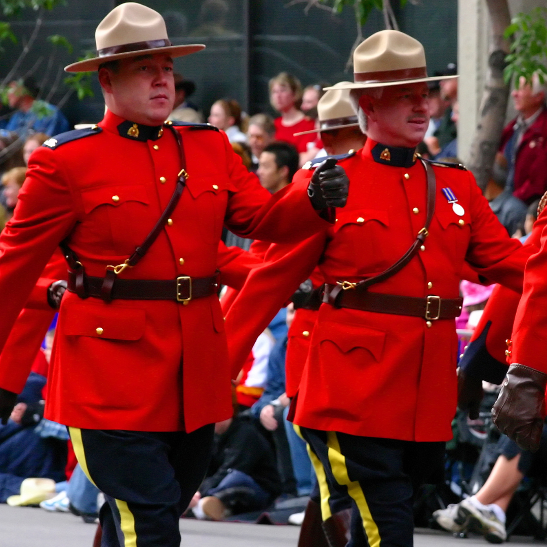 Men in red uniforms serving in military service jobs.